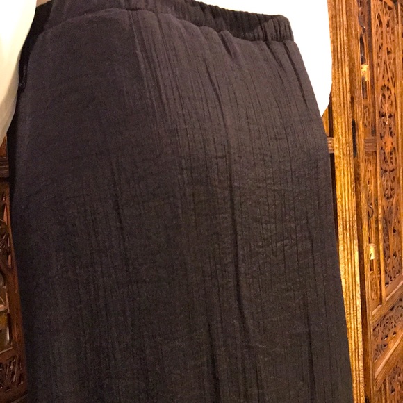 Black Skirt with High-Low Hemline and front slit with cascading ruffles. - Picture 7 of 14